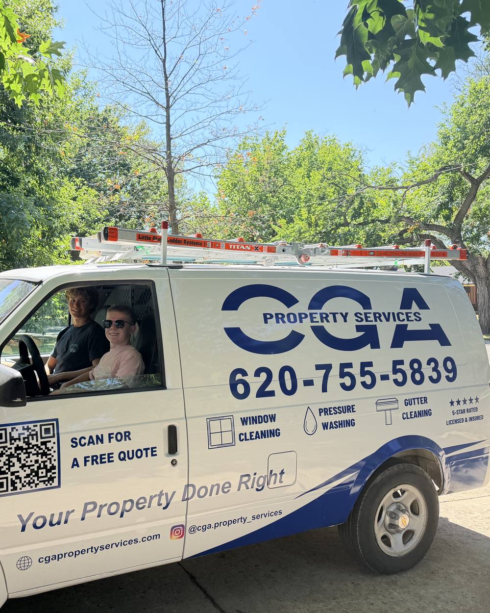 Colt and Ace of CGA Property Services in the company van